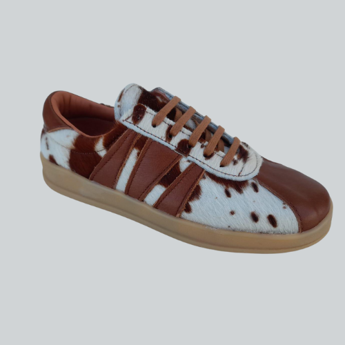 Championes en cuero con diseño Cow Print